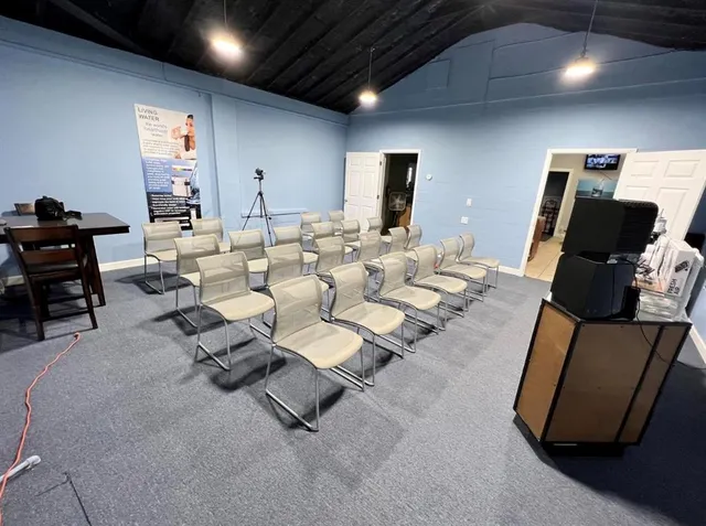 a living room with furniture and a flat screen tv