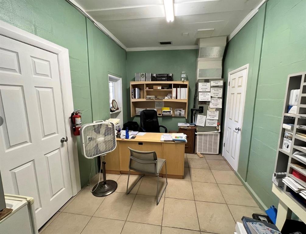 2315 West Old US Highway 441 Mount Dora, FL 32757 - Photo 13 of 19 a living room with furniture and a book shelf