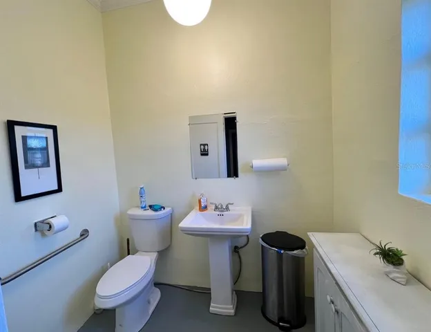 a view of a closet area with a bathroom