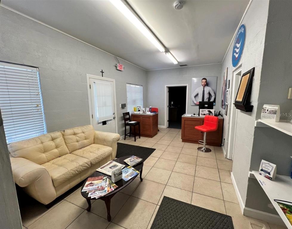 2315 West Old US Highway 441 Mount Dora, FL 32757 - Photo 7 of 19 a living room with furniture and a flat screen tv
