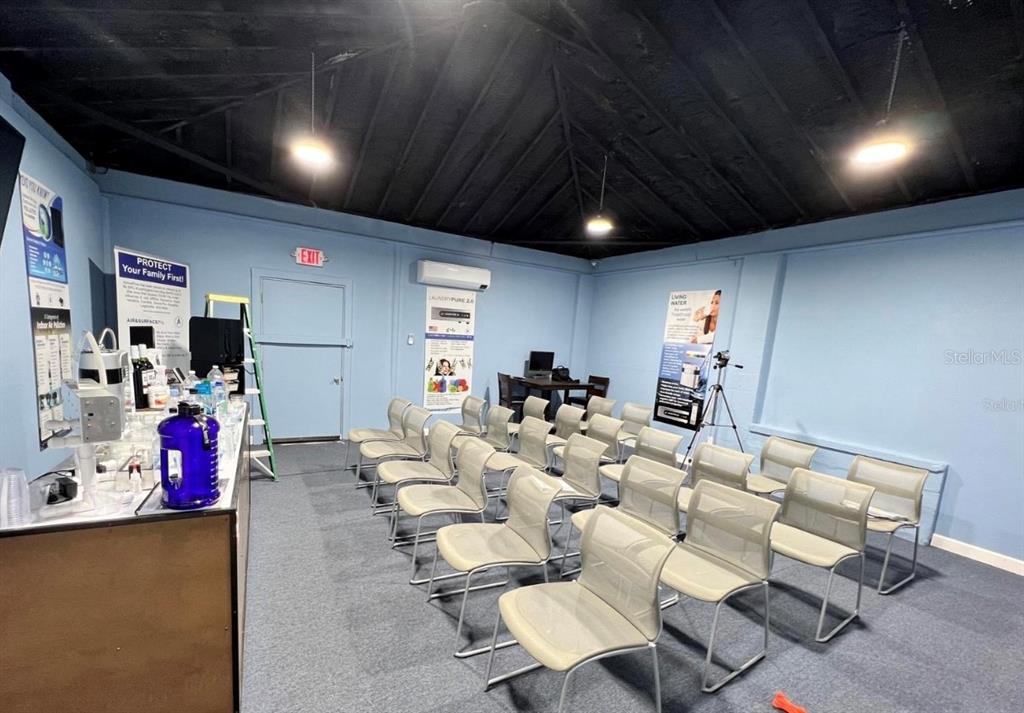 2315 West Old US Highway 441 Mount Dora, FL 32757 - Photo 10 of 19 a living room with furniture a pool table and a fireplace