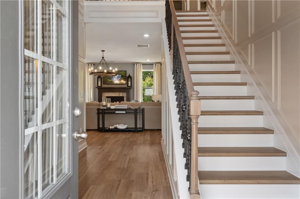 412 Hartsfield Road McDonough, GA 30252 - Photo 2 of 43 a view of a hallway with wooden floor and entryway