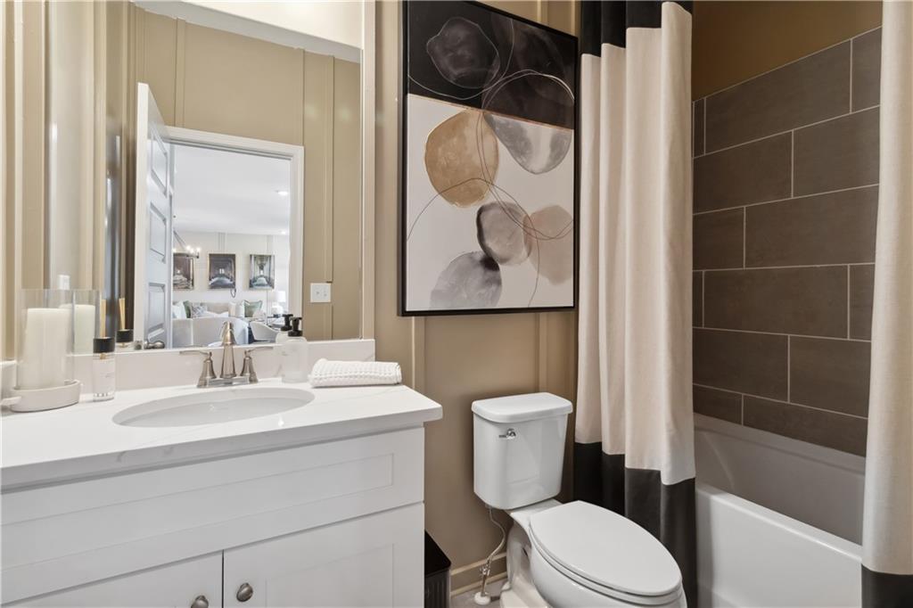 412 Hartsfield Road McDonough, GA 30252 - Photo 21 of 43 a bathroom with a toilet sink and shower