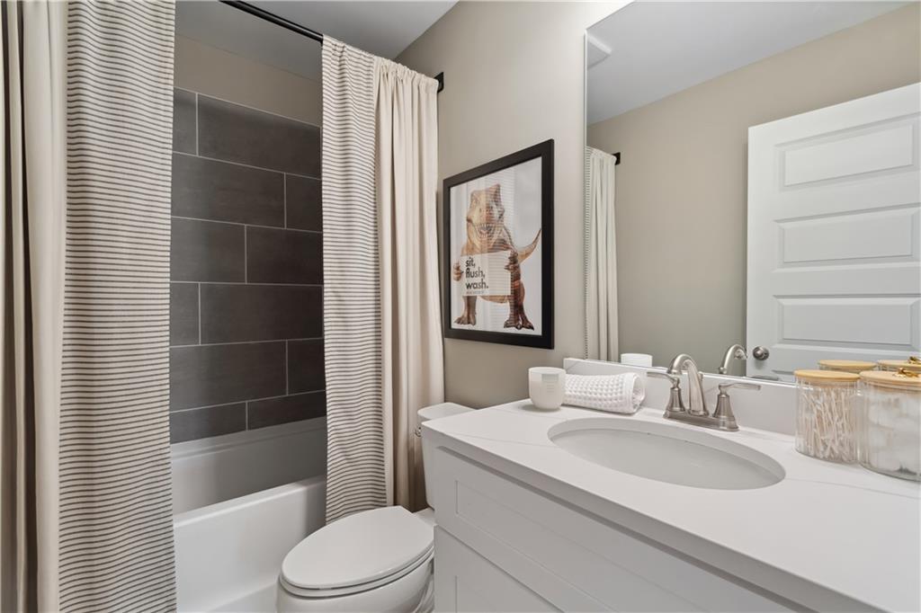 412 Hartsfield Road McDonough, GA 30252 - Photo 27 of 43 a bathroom with a sink toilet and shower