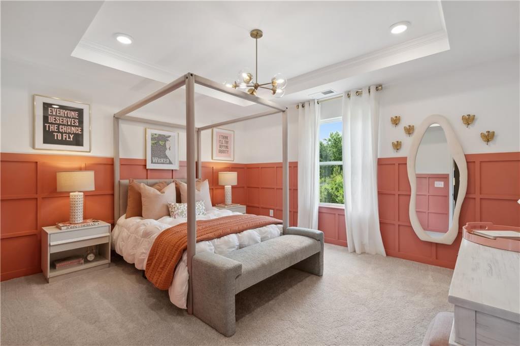 412 Hartsfield Road McDonough, GA 30252 - Photo 30 of 43 a bedroom with a bed a chandelier and dresser