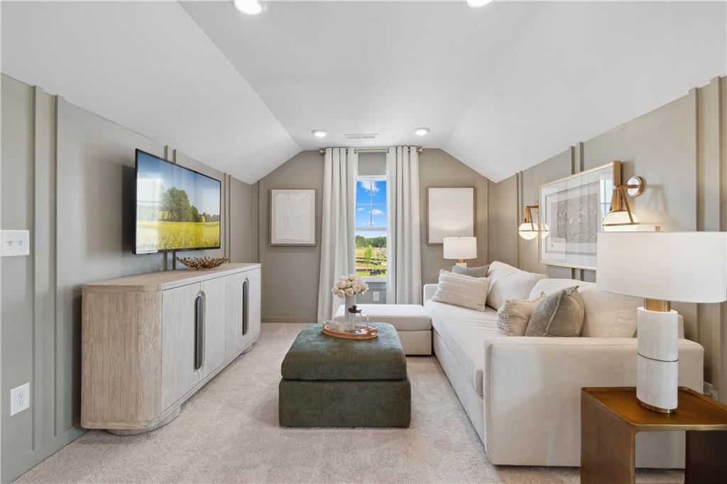 412 Hartsfield Road McDonough, GA 30252 - Photo 35 of 43 a living room with furniture and a flat screen tv