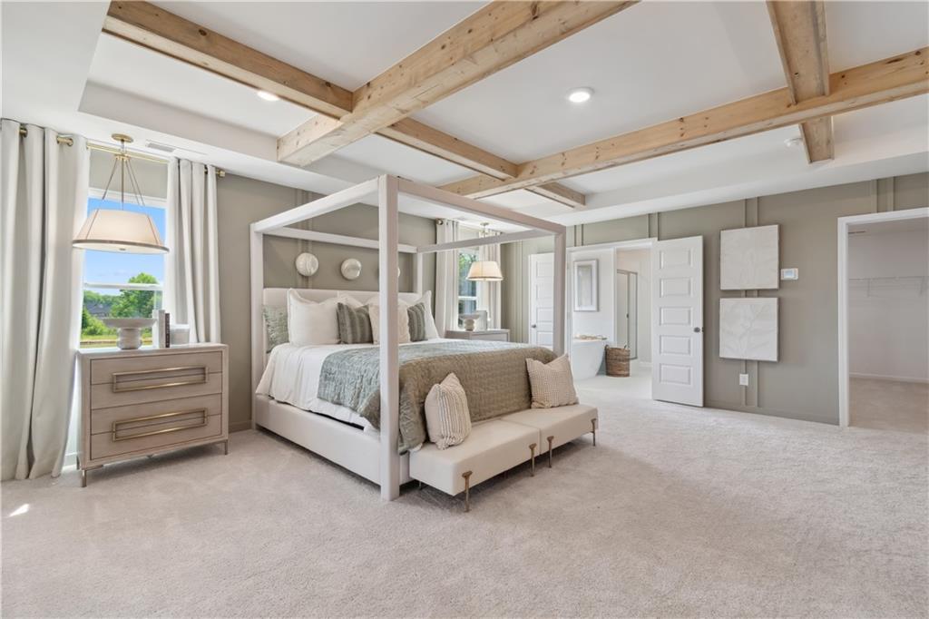 412 Hartsfield Road McDonough, GA 30252 - Photo 36 of 43 a bed sitting in a spacious bedroom next to a window