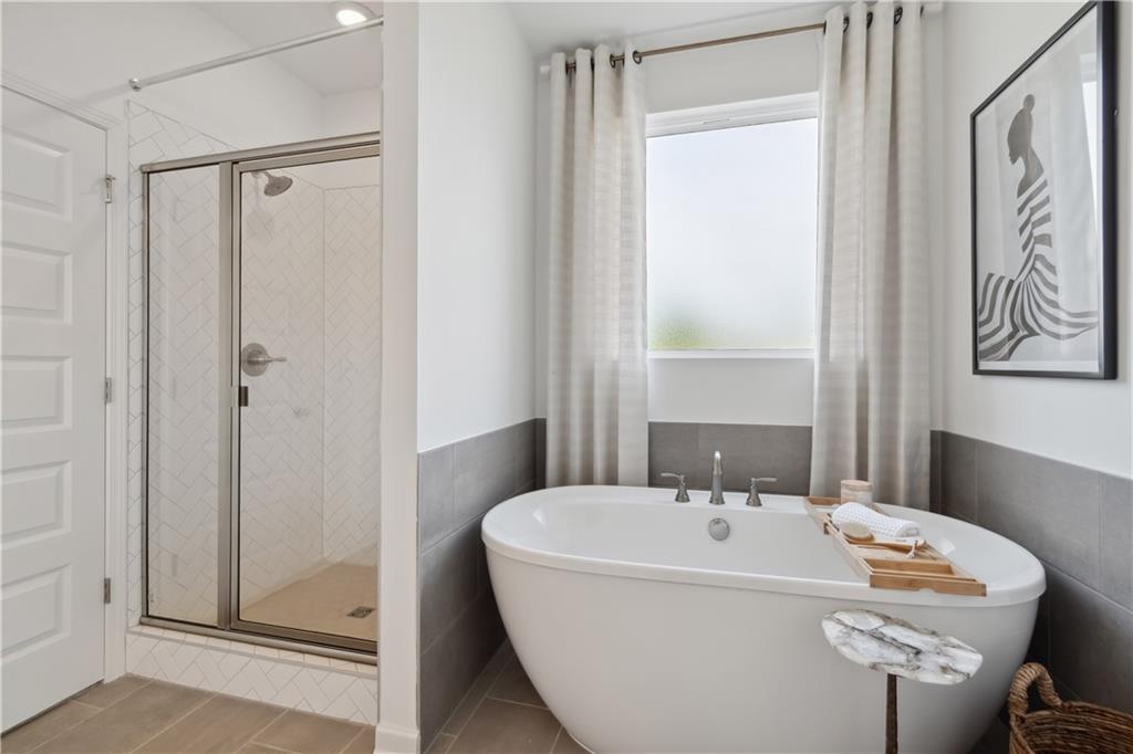 412 Hartsfield Road McDonough, GA 30252 - Photo 8 of 43 a white bath tub sitting next to a white sink