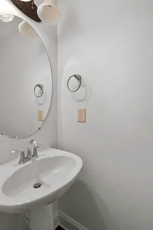 a bathroom with a sink and mirror