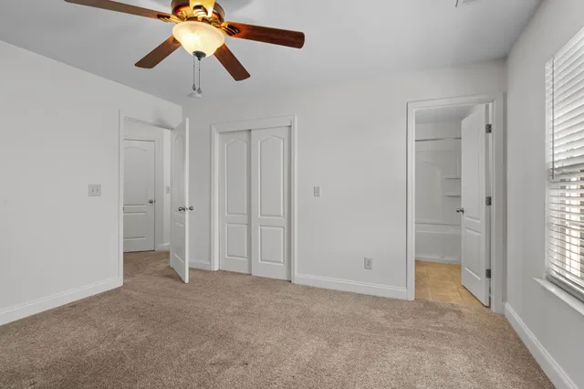 a view of an empty room and window