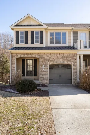 a front view of a house with yard