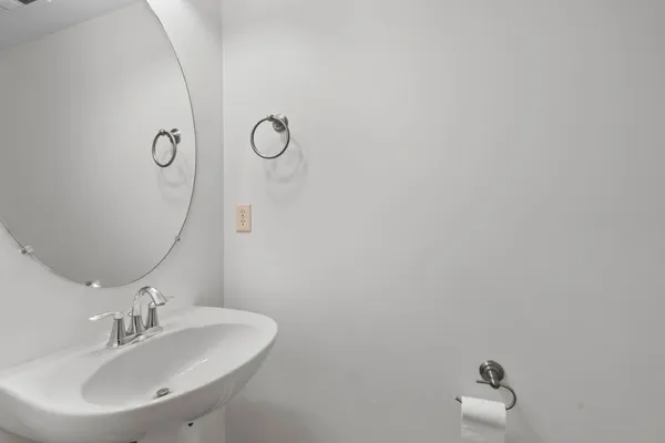 a bathroom with a sink and mirror