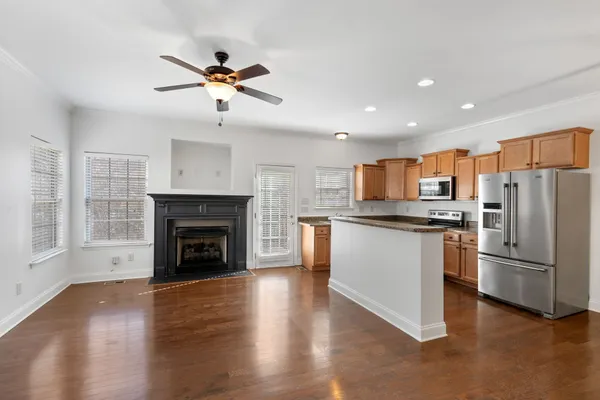 a kitchen with stainless steel appliances a refrigerator a stove and a refrigerator
