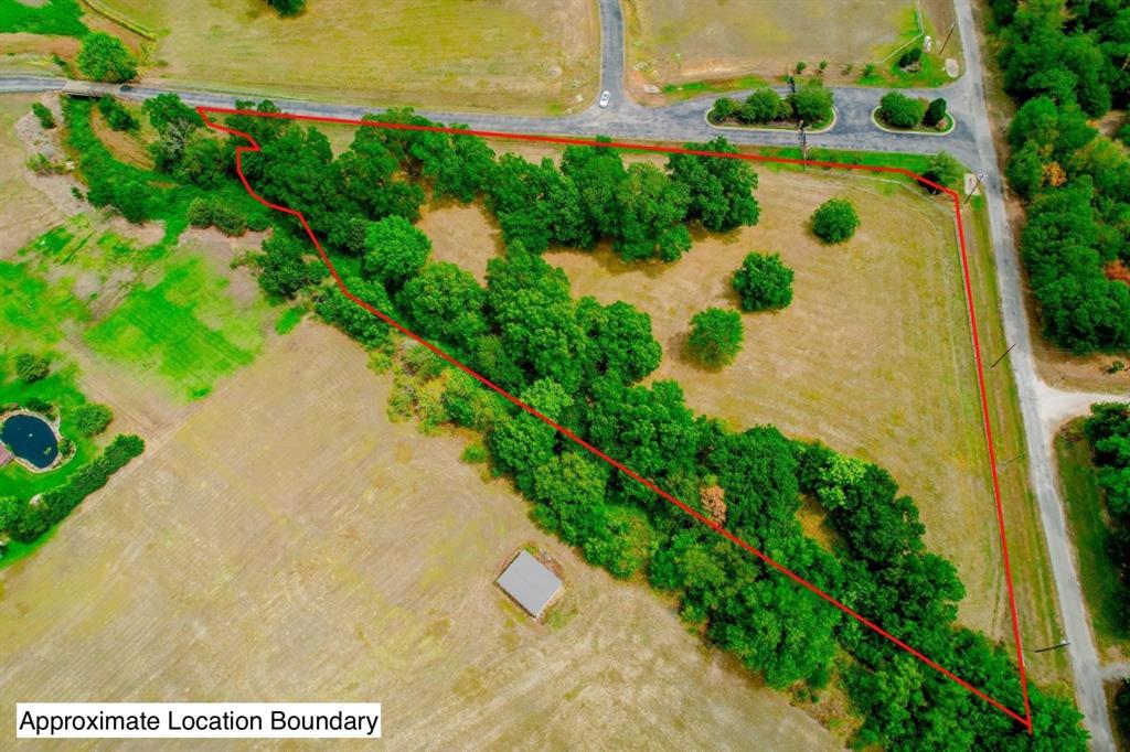 a view of a lake with a yard