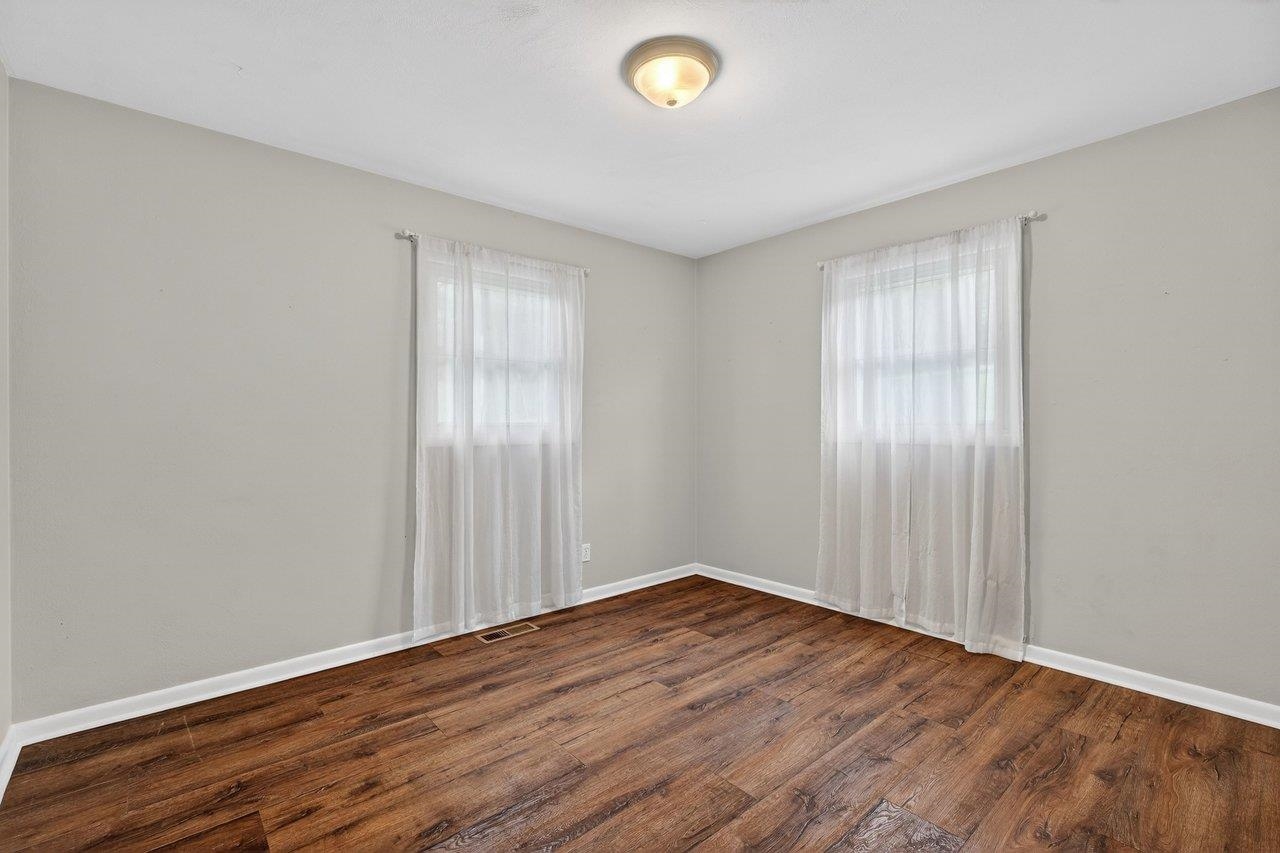 3259 Zion Church Road Broadway, VA 22815 - Photo 20 of 48 an empty room with wooden floor and windows