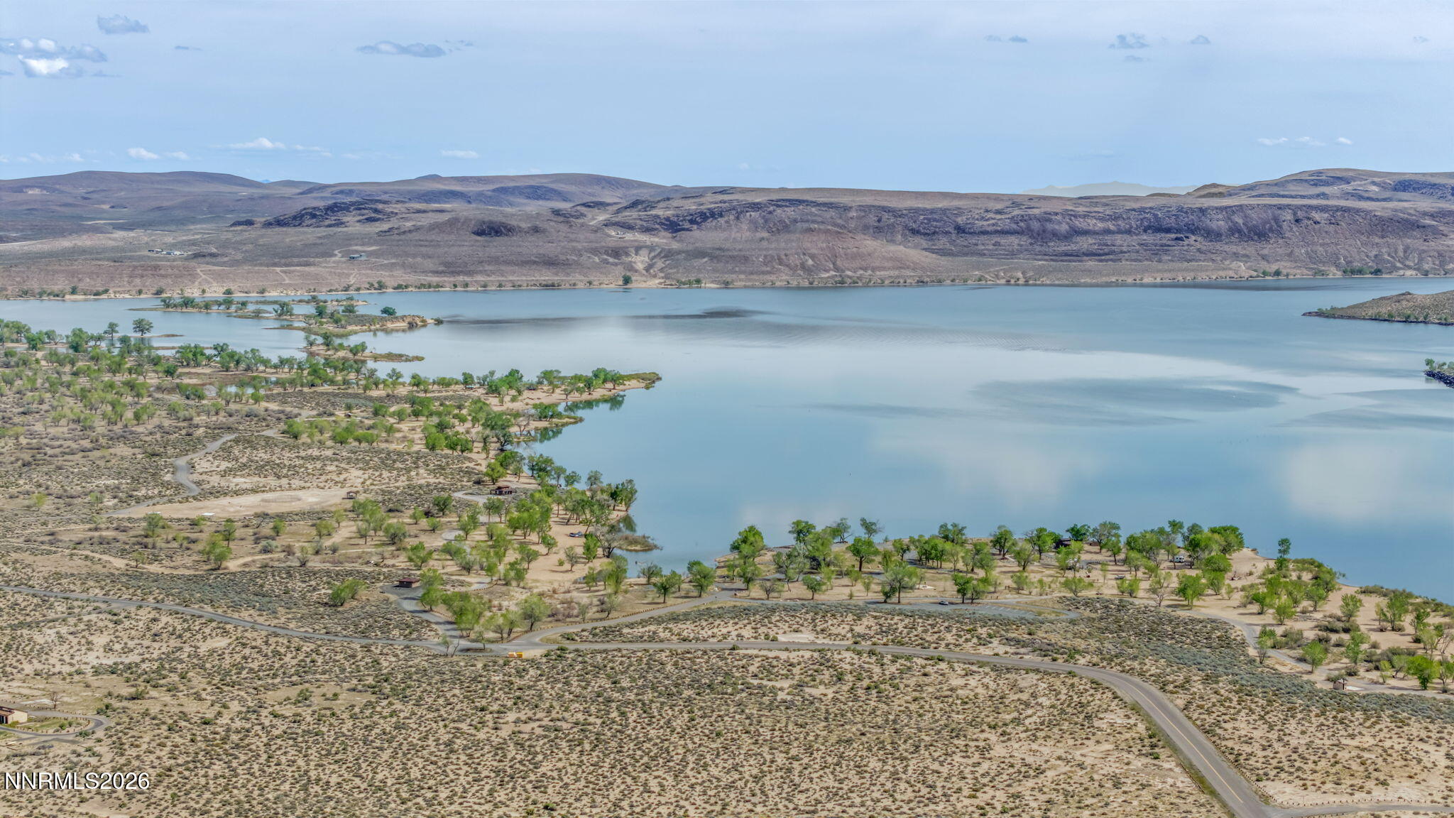 3720 Lemon Street Silver Springs, NV 89429 - Photo 13 of 23 a view of a lake with mountains in the background