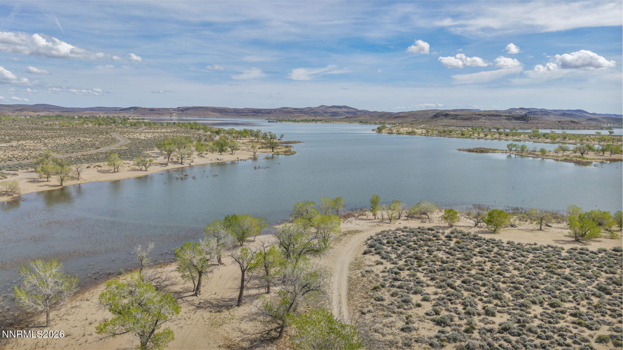 3720 Lemon Street Silver Springs, NV 89429 - Photo 8 of 23 a view of a lake with beach