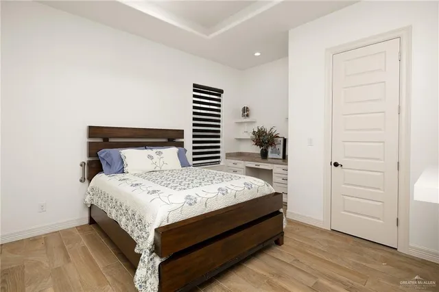 a bed room with a bed and a window