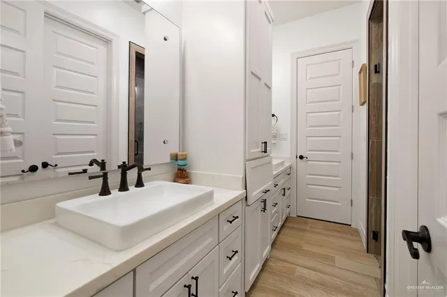 a spacious bathroom with a double vanity sink mirror and double