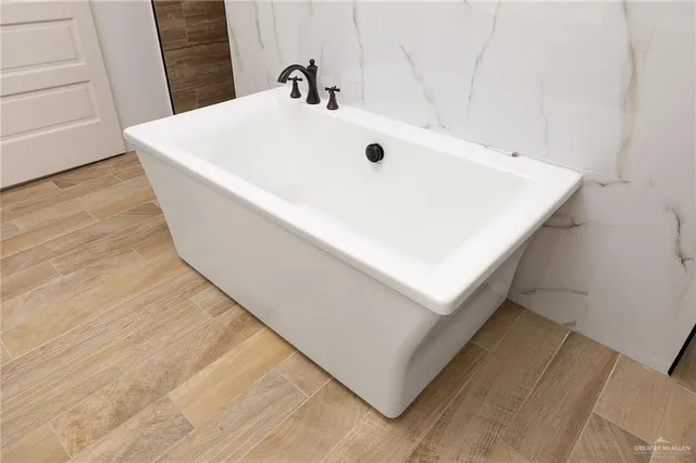 a view of a house with swimming pool and sitting area