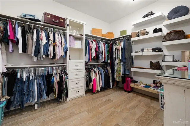 a view of a house with floor to ceiling windows and a basket ball poll