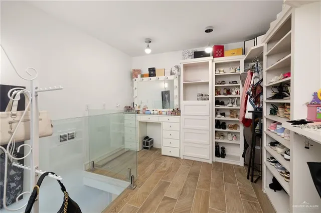 a kitchen with stainless steel appliances kitchen island granite countertop a sink and cabinets
