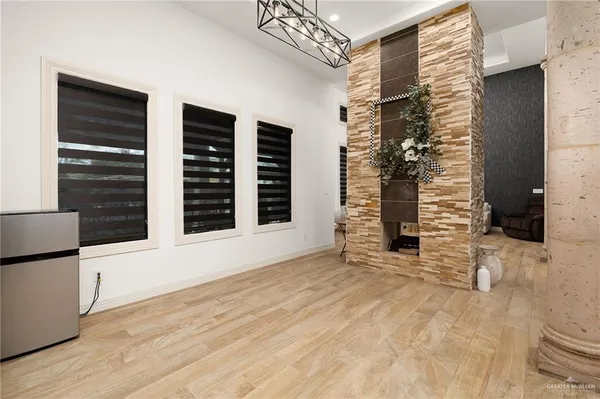 a kitchen with stainless steel appliances granite countertop a stove and white cabinets