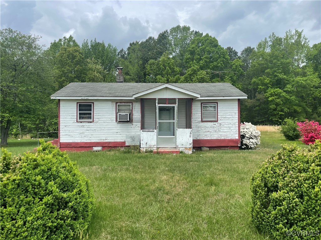 17808 Depot Road McKenney, VA 23872 - Photo 1 of 4 a front view of a house with a yard and trees