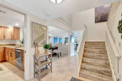 a kitchen with stainless steel appliances granite countertop a sink a stove a microwave and cabinets