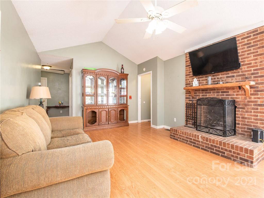 128 Altan Ridge Drive Monroe, NC 28112 - Photo 2 of 42 a living room with fireplace furniture and a flat screen tv