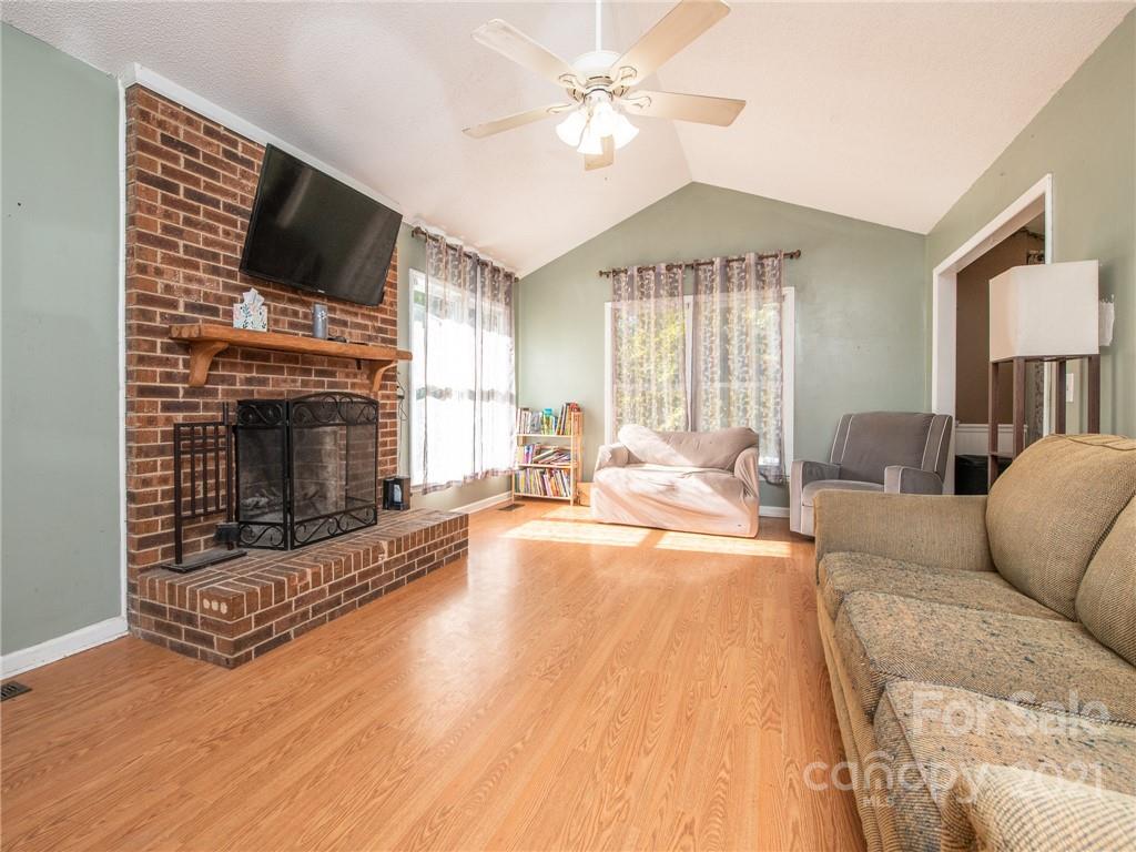128 Altan Ridge Drive Monroe, NC 28112 - Photo 12 of 42 a living room with furniture fireplace and flat screen tv