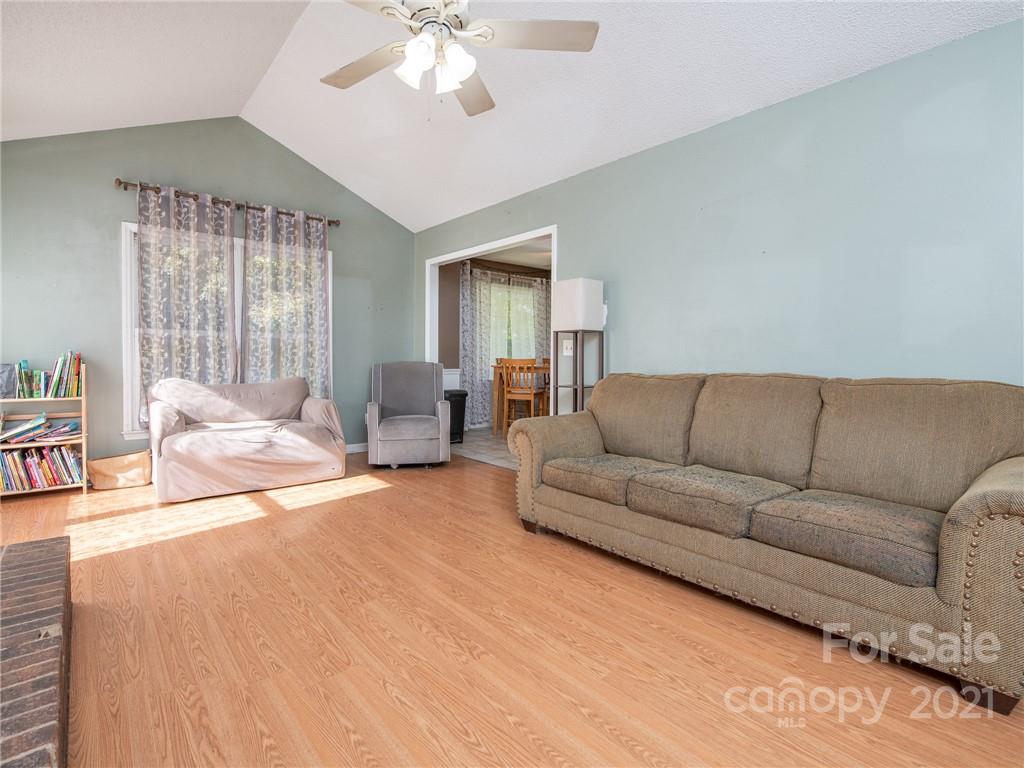 128 Altan Ridge Drive Monroe, NC 28112 - Photo 13 of 42 a living room with furniture and a large window