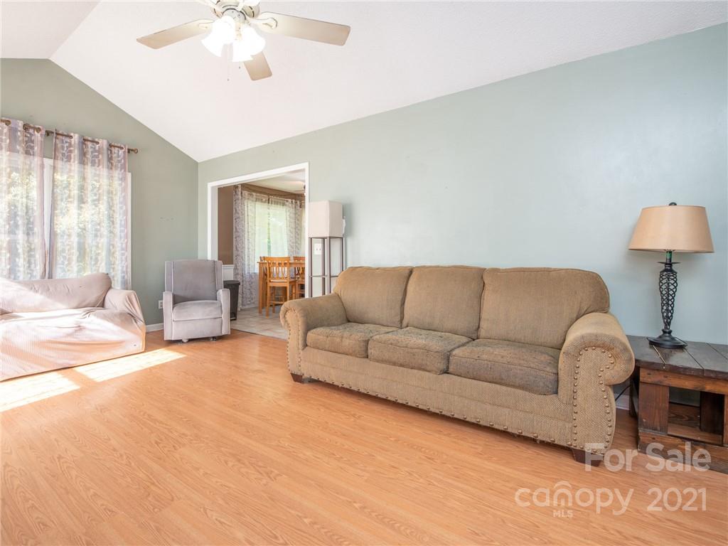 128 Altan Ridge Drive Monroe, NC 28112 - Photo 14 of 42 a living room with furniture and a large window