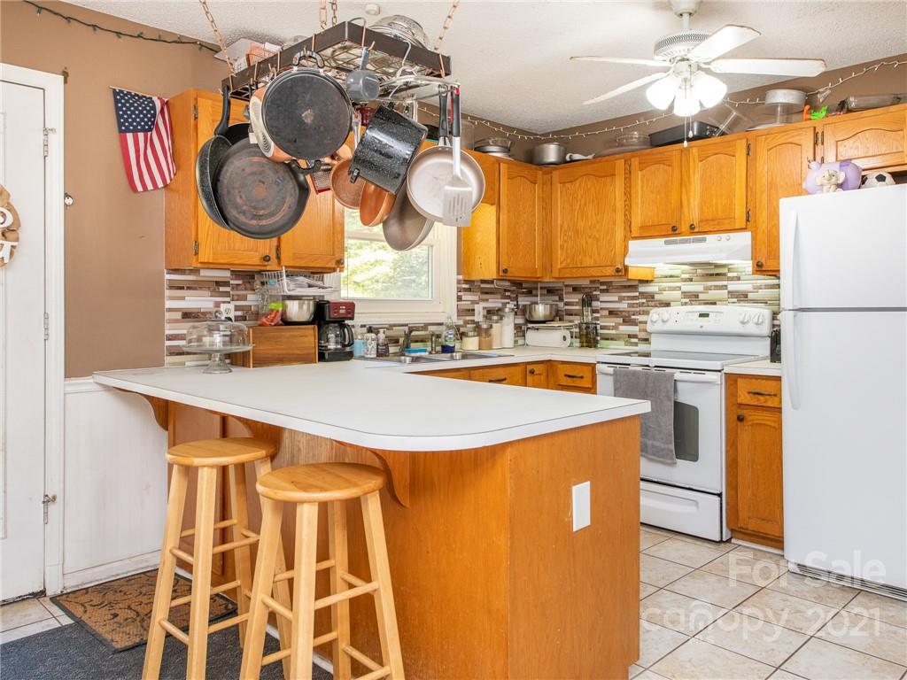 128 Altan Ridge Drive Monroe, NC 28112 - Photo 16 of 42 a kitchen with cabinets and window