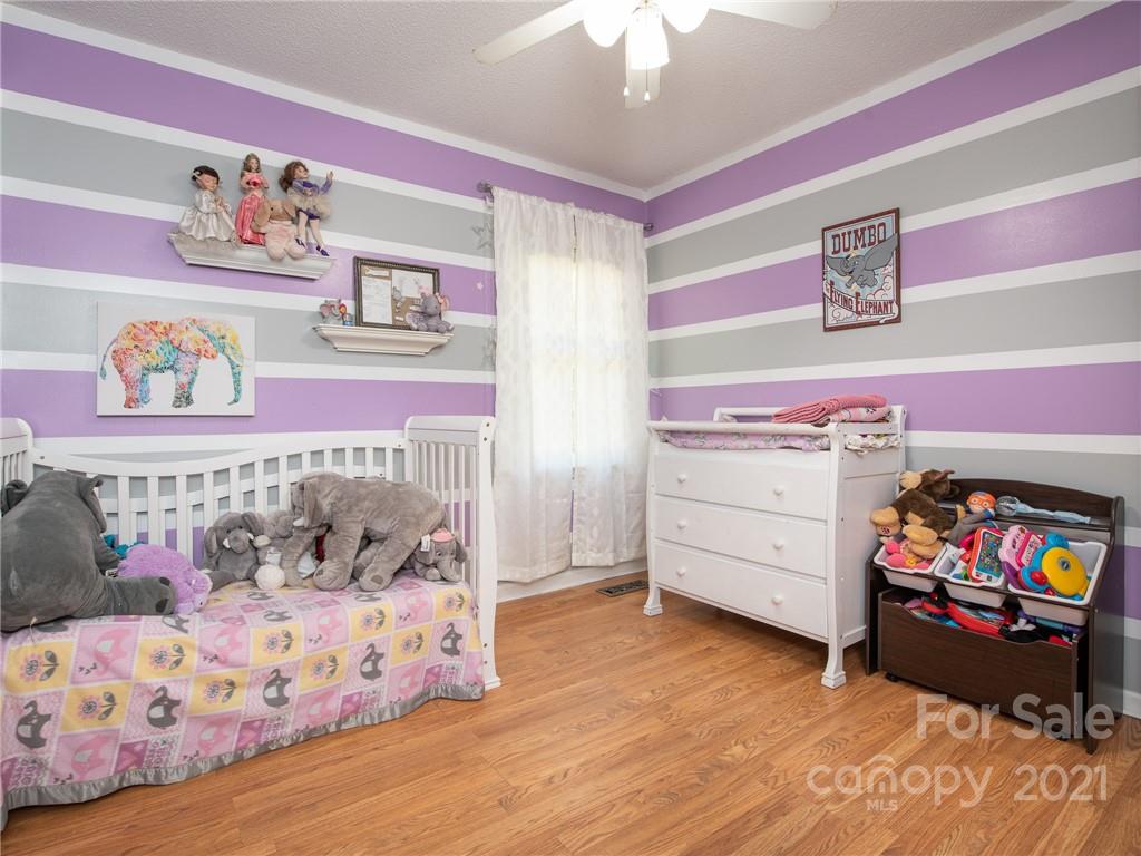 128 Altan Ridge Drive Monroe, NC 28112 - Photo 26 of 42 a bedroom with a bed and a dresser