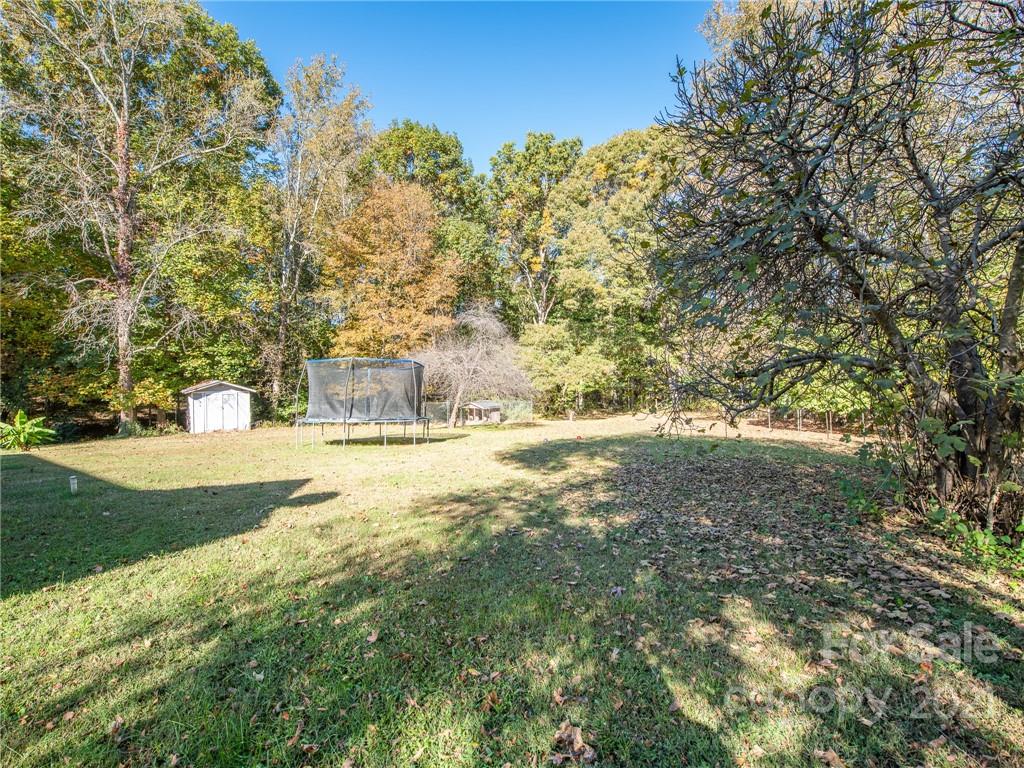 128 Altan Ridge Drive Monroe, NC 28112 - Photo 32 of 42 a view of yard with green space and trees