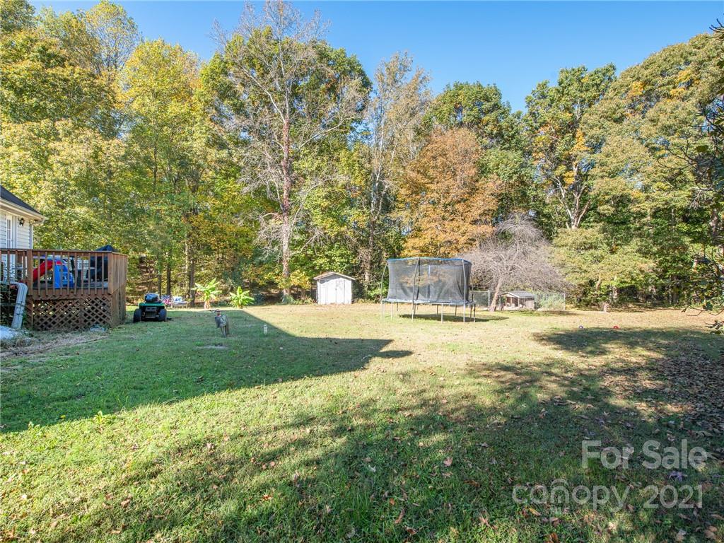 128 Altan Ridge Drive Monroe, NC 28112 - Photo 36 of 42 a view of yard with swimming pool and green space