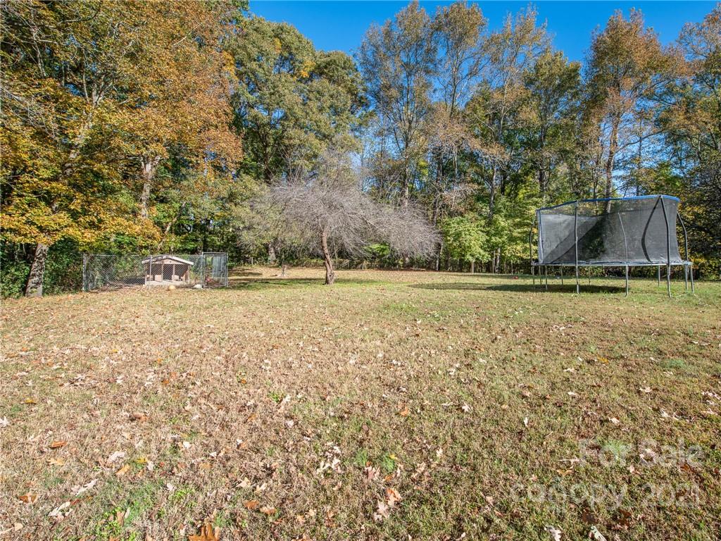 128 Altan Ridge Drive Monroe, NC 28112 - Photo 39 of 42 a backyard of a house with lots of green space
