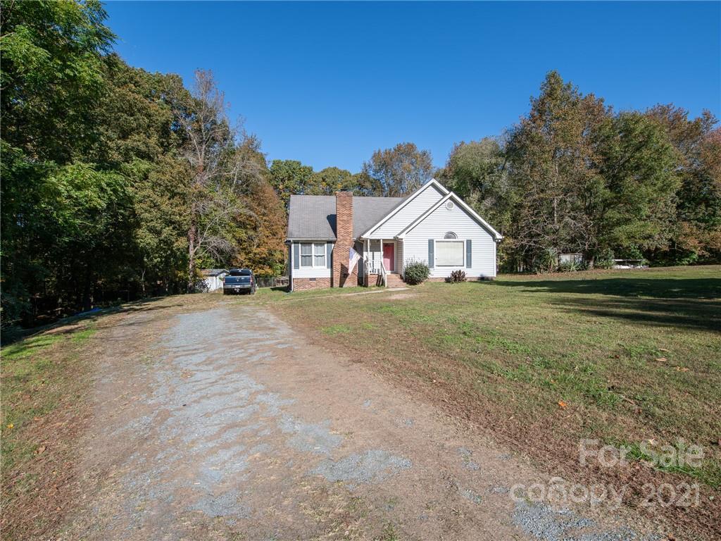 128 Altan Ridge Drive Monroe, NC 28112 - Photo 40 of 42 a view of a house with a yard