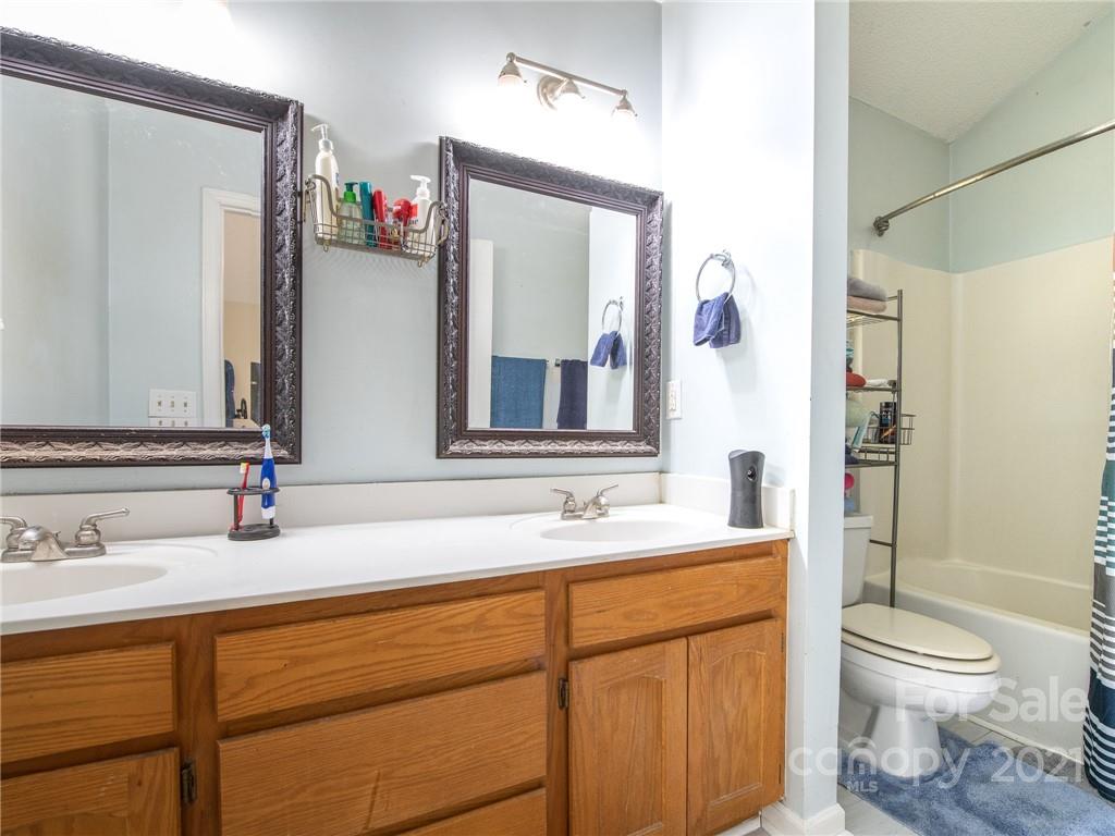 128 Altan Ridge Drive Monroe, NC 28112 - Photo 6 of 42 a bathroom with a sink and a mirror