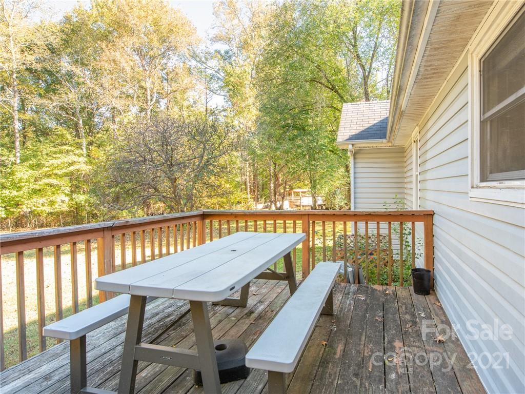 128 Altan Ridge Drive Monroe, NC 28112 - Photo 7 of 42 a view of a balcony with wooden floor and outdoor seating