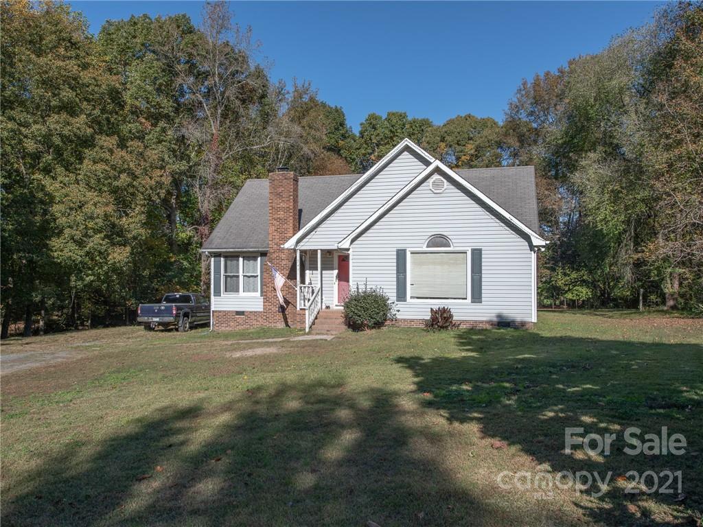 128 Altan Ridge Drive Monroe, NC 28112 - Photo 9 of 42 a view of a house with a yard
