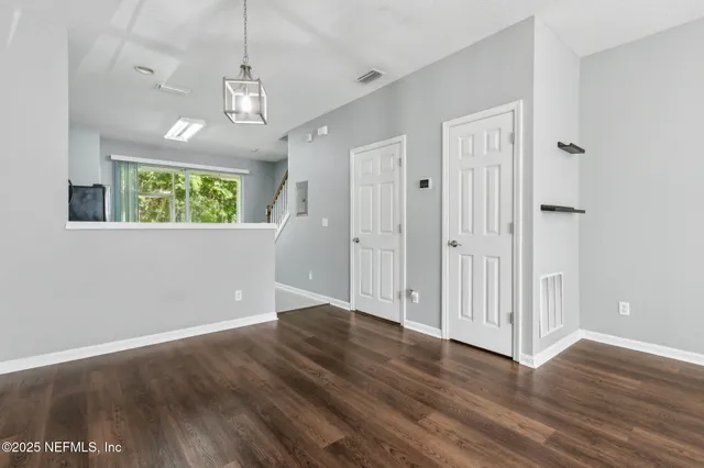 a kitchen with stainless steel appliances a stove refrigerator sink and cabinets