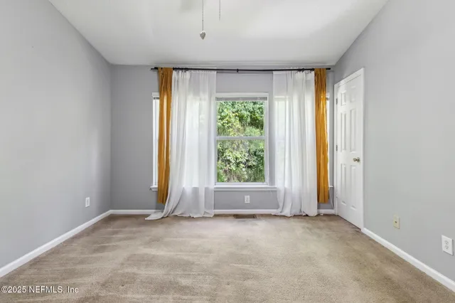 a view of room with window and outdoor view