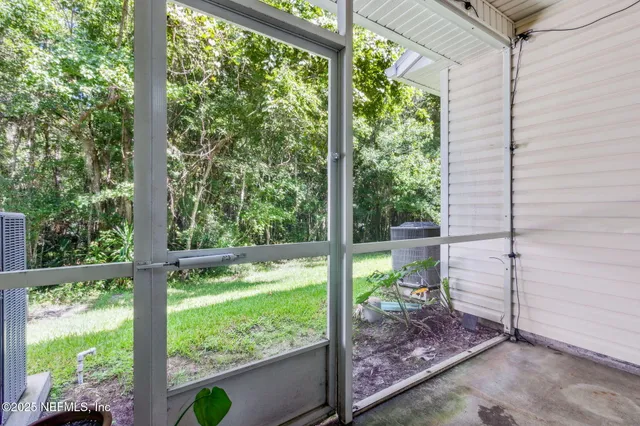 a view of backyard with green space