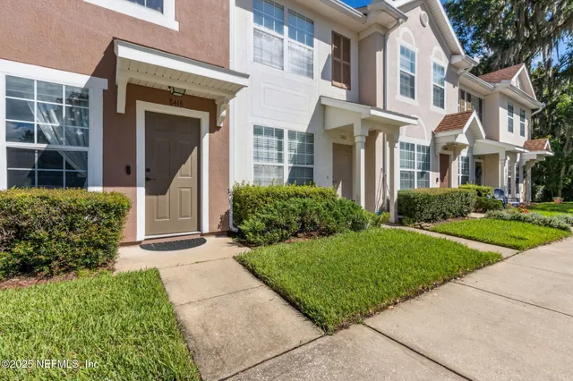 a view of a car parked in front of a house