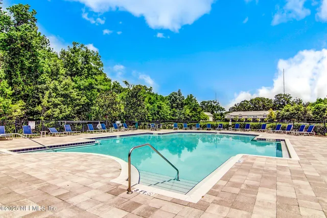 an aerial view of a house with outdoor space