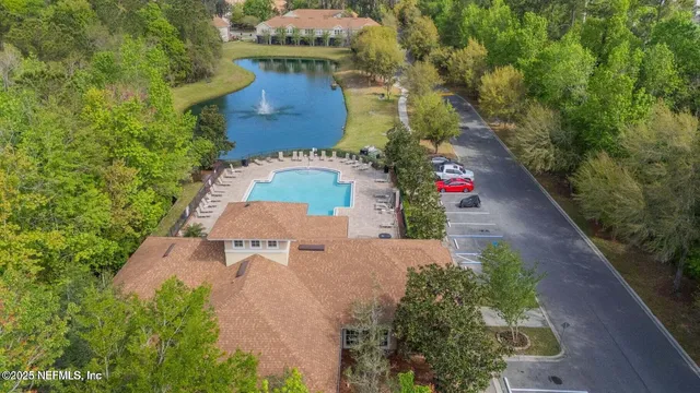 a view of backyard with a patio and a garden