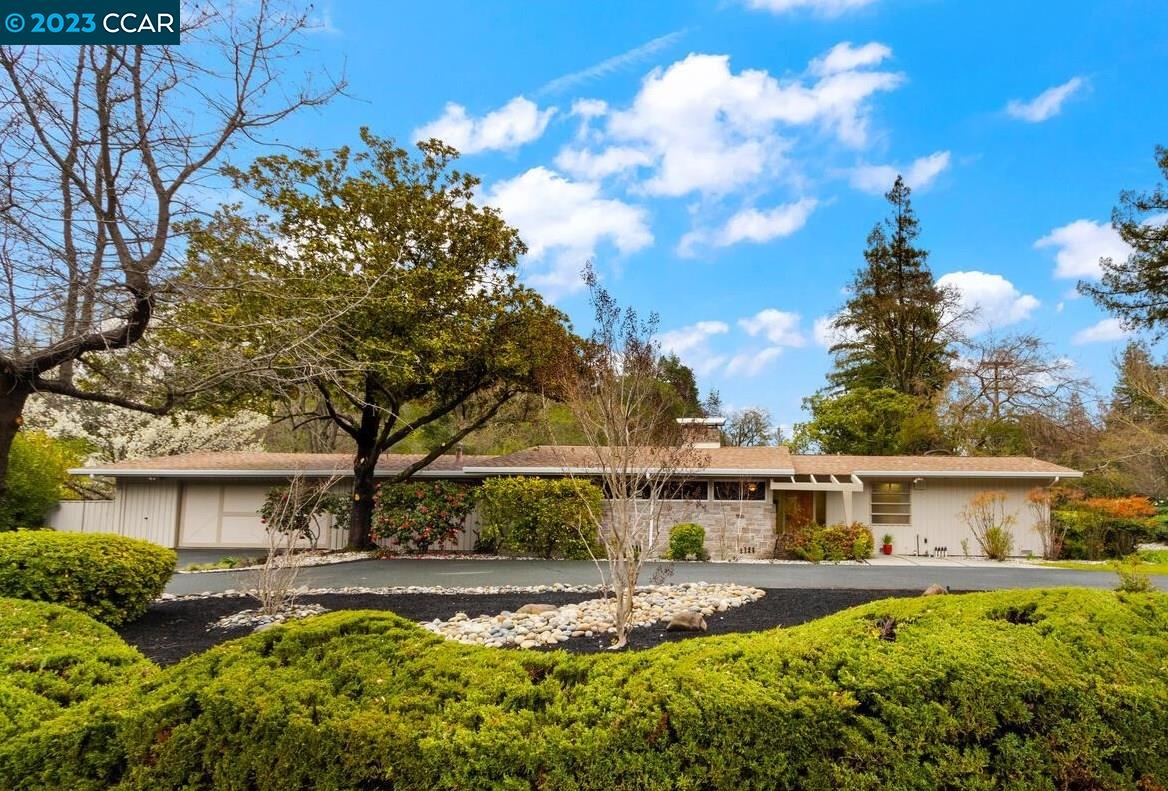 3556 Silver Springs Road Lafayette, CA 94549 - Photo 1 of 1 a view of a house with swimming pool and sitting area