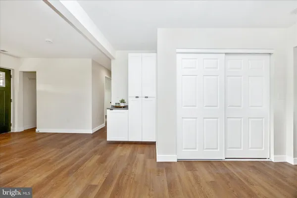 an empty room with wooden floor